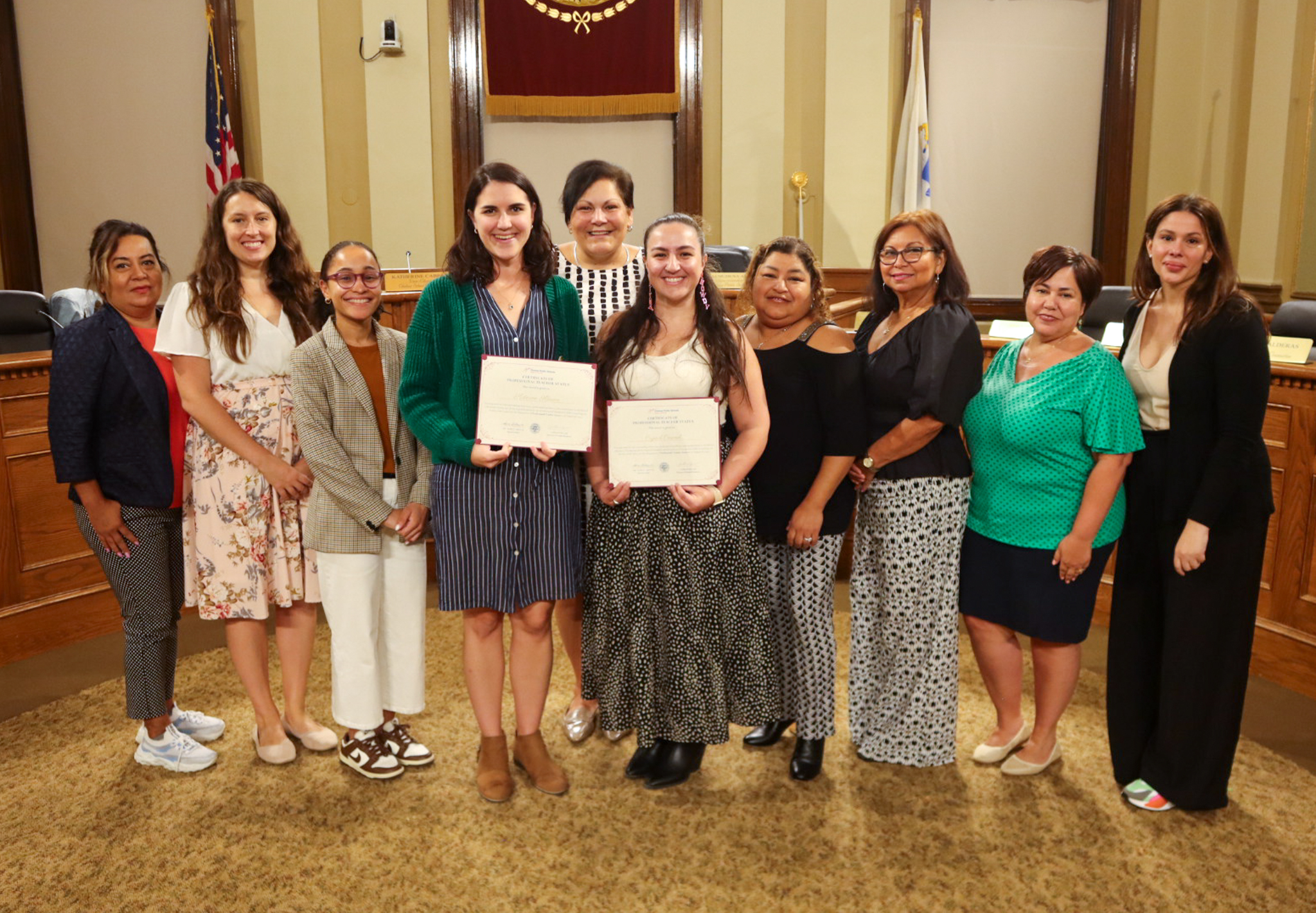CPS teachers who earned professional status pictured with certificates with the Chelsea School Committee